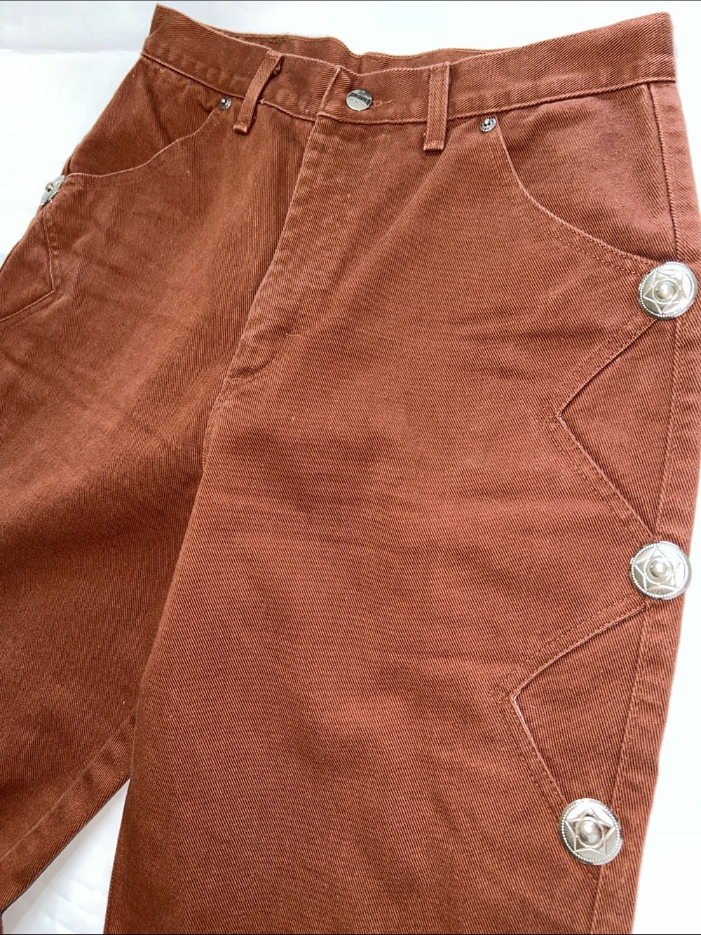 Roughrider western wear. High-Waist Jeans with Decorative Concho’s on side legs